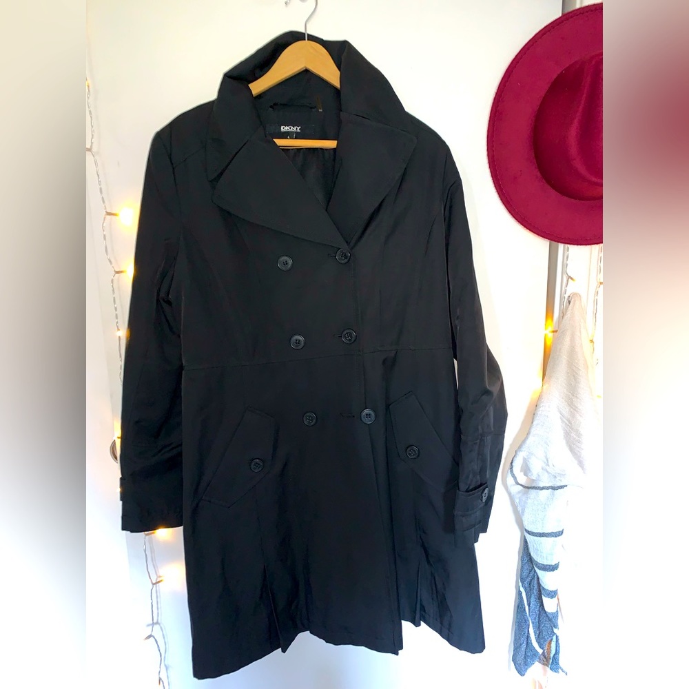 DKNY black trench coat. Has pockets and can be adjusted.About 34” long